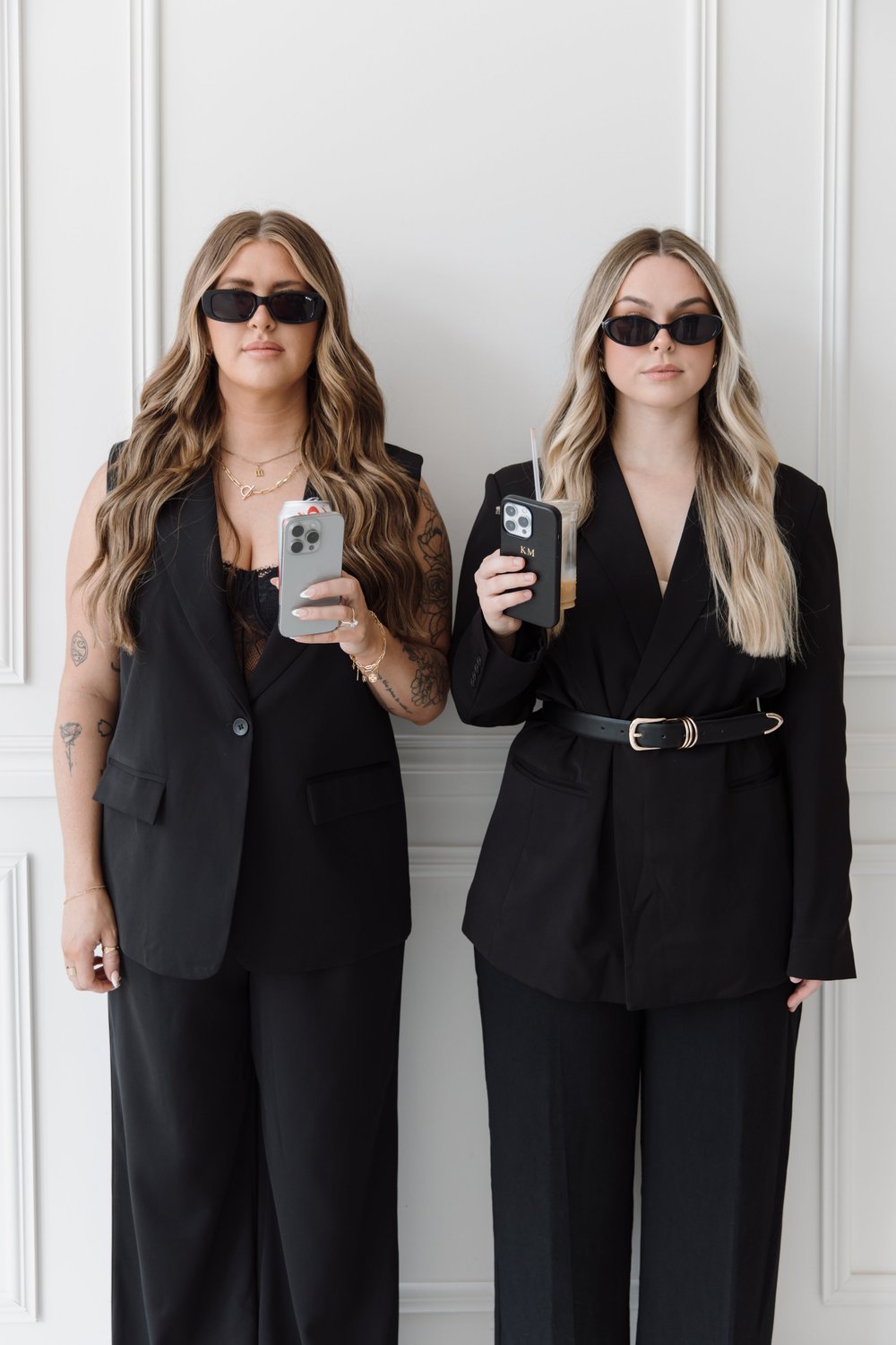 Noah Social team members with phones at a brand shoot